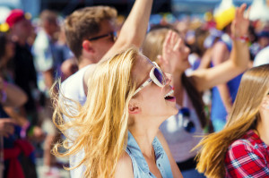 45742533 - group of beautiful teens at concert at summer festival